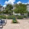 a pool and chairs outside of a building