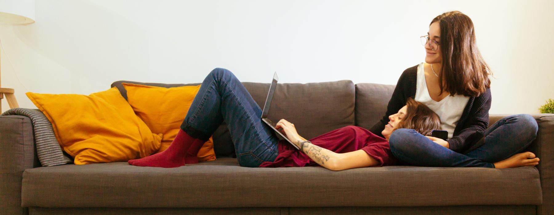 a person and a child sitting on a couch