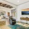 a living room with a large painting
