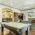 a large kitchen with a bar and island