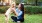a person kneeling next to a dog