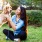 a person kneeling next to a dog
