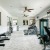 a room with treadmills and a ceiling fan
