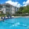 a swimming pool with chairs around it