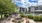 a patio with chairs and a fountain