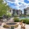 a patio with chairs and a fountain