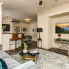 living room with couch tv and ceiling fan
