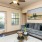 a living room with a couch and a fan