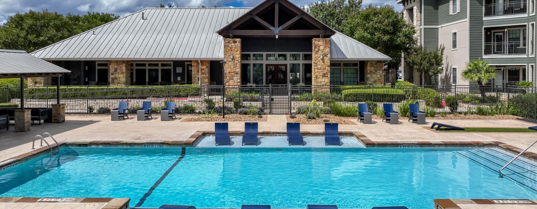 a swimming pool in front of a building