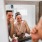 a person with a mustache and a beard in a mirror