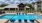 a swimming pool in front of a building